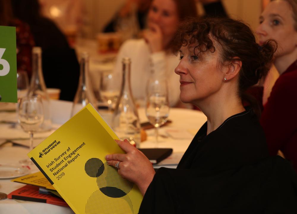 Person reading report at launch